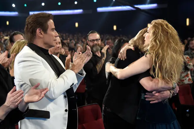 The friends embraced has the crowd applauded. (Photo by Kevin Mazur/WireImage)